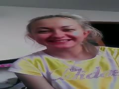 Smiling blonde is talking dirty on the camera on Russian